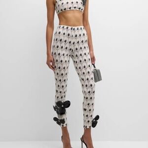 AREA eye crochet knit pants featuring crystal flower applique